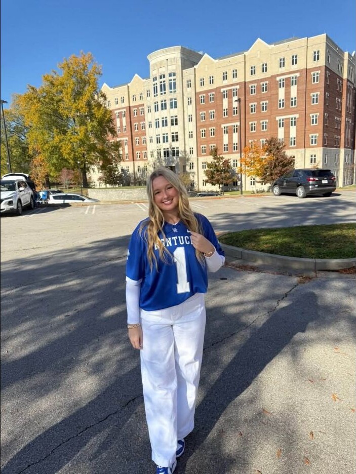 Gracie Hollars wearing a Kentucky jersey outdoors