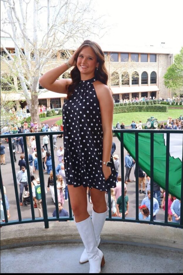 Jaylee Roy standing on a balcony