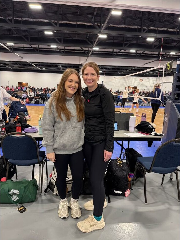 Elizabeth Wilson and Micah Thompson courtside at a volleyball tournament