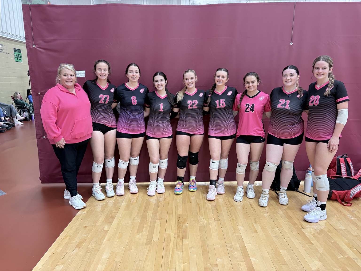 A BAMVC team and its coach together at a tournament